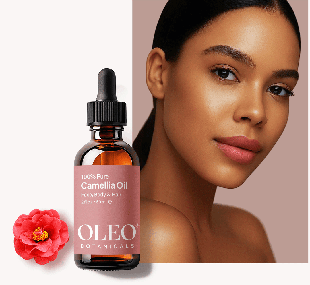 Model with glowing skin beside Oleo Botanicals Camellia Oil bottle and camellia flower on a blush-toned background